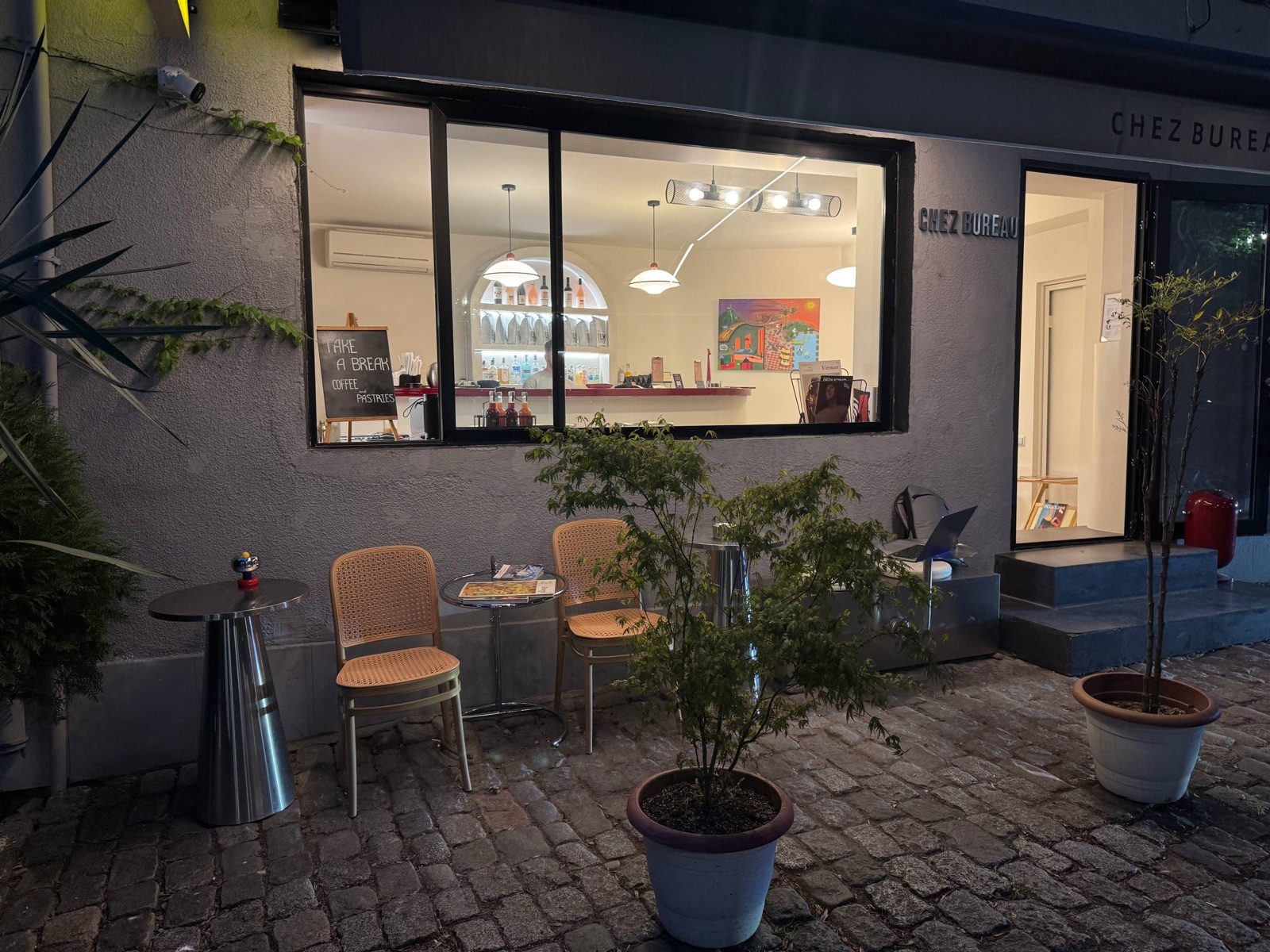 The patio at night — chairs by the window