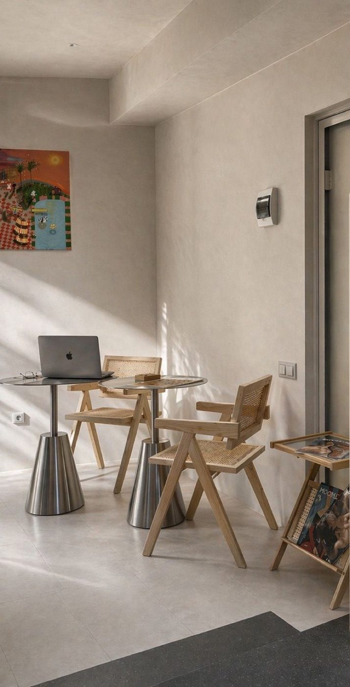 The reading corner — rattan chairs and round table