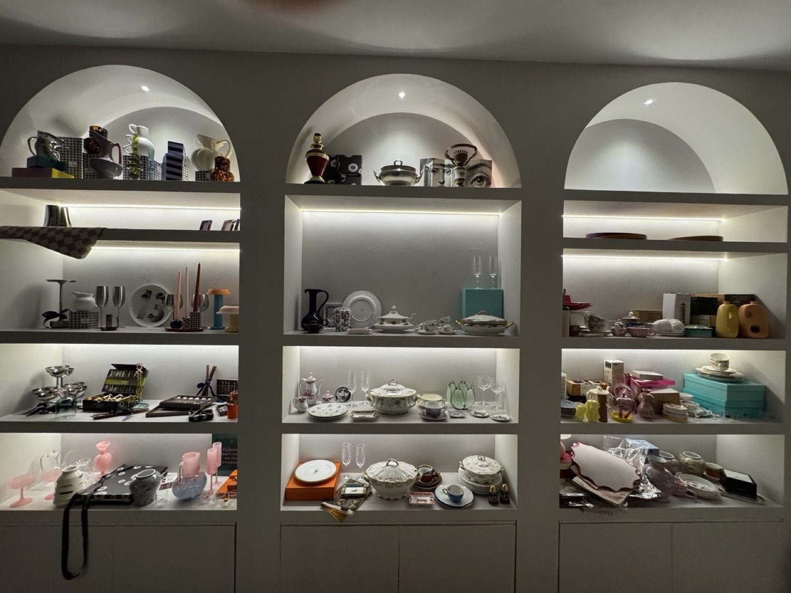 Carefully arranged shelves of ceramics and glassware at Bureau.Subjects